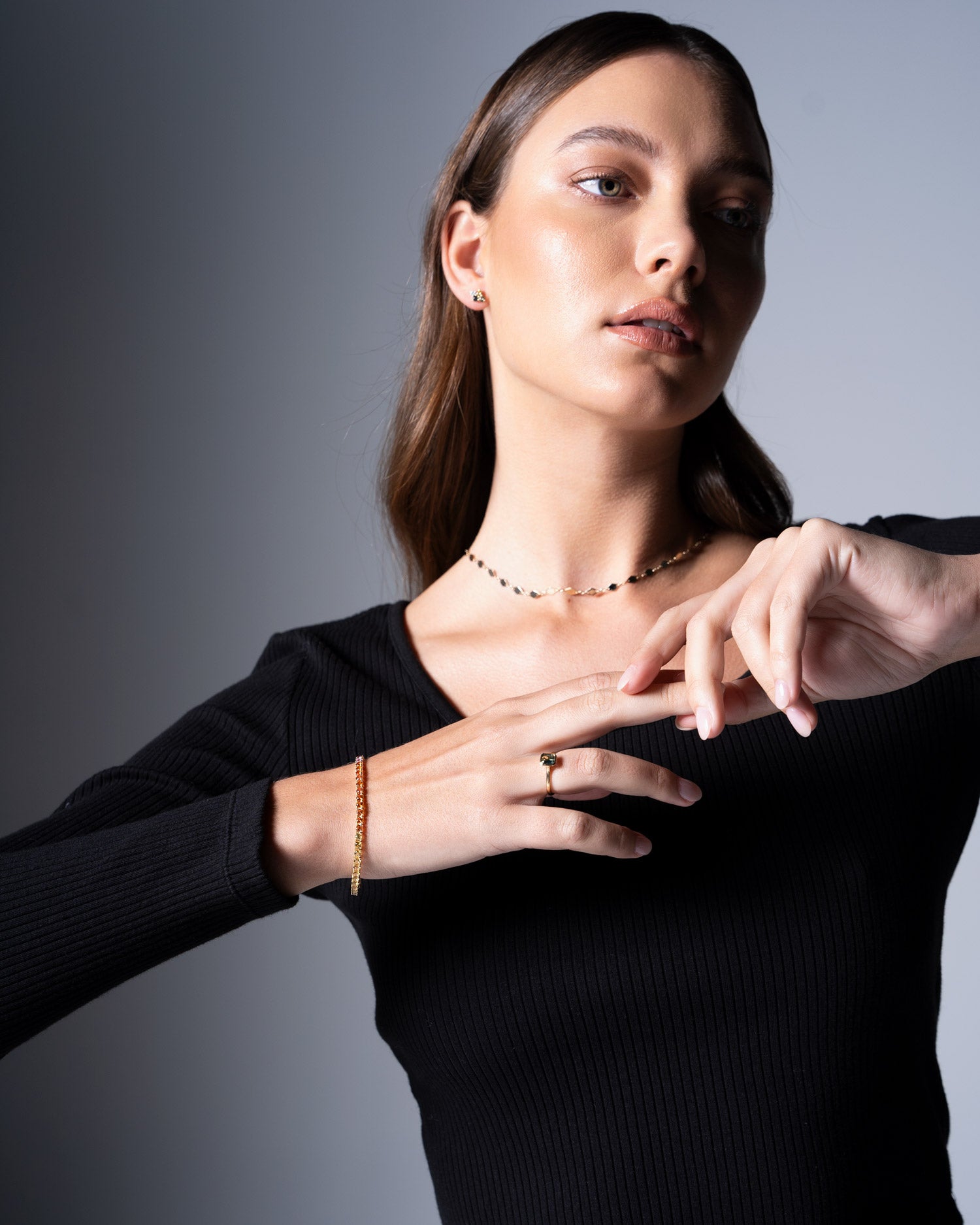 multi colour sapphire bracelet worn on wrist by model Ellie Brinkman