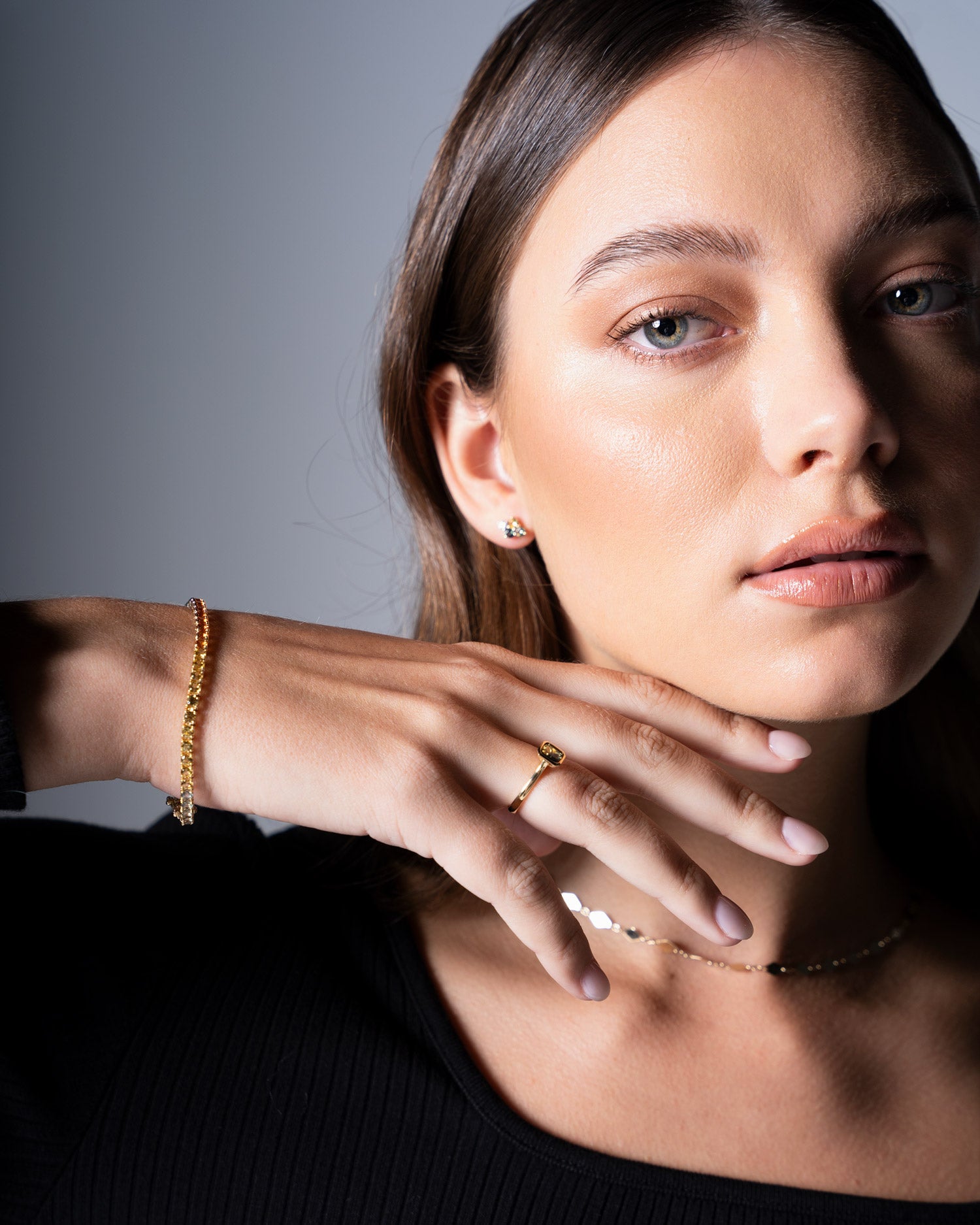 multi colour sapphire bracelet worn on wrist by model Ellie Brinkman