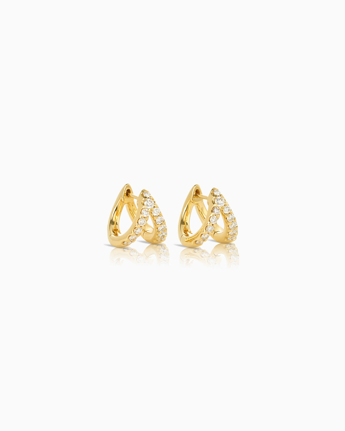 side view of 18k yellow gold diamond V huggies