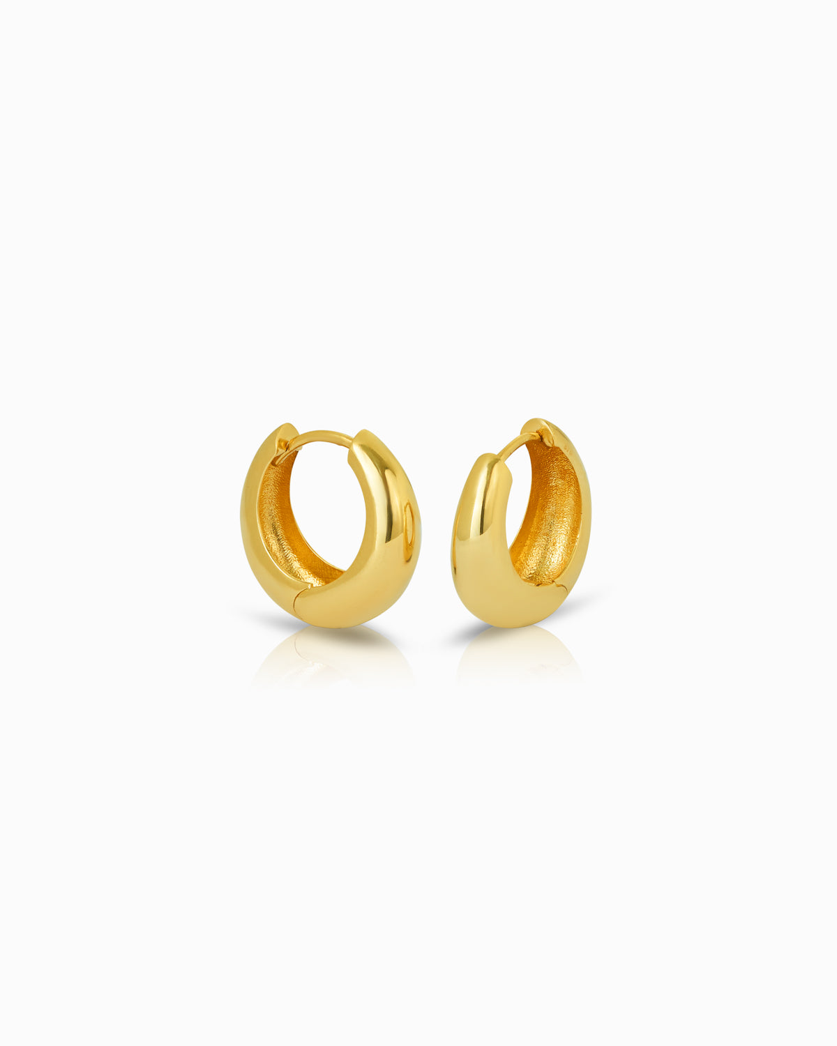 10mm 9k yellow gold graduated huggie earrings with a rounded, polished silhouette from the Claude by Claudia collection.