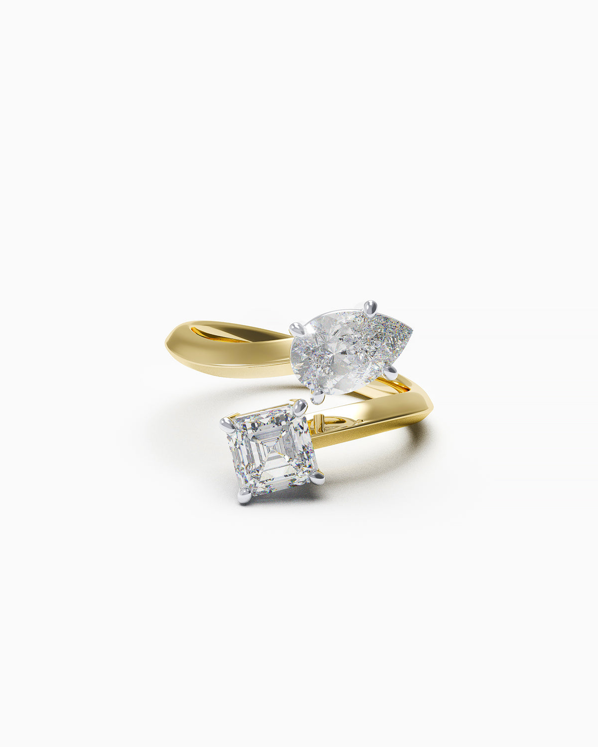 Toi et Moi bypass ring in 18k yellow gold with pear and Asscher-cut diamonds, front view on white background.