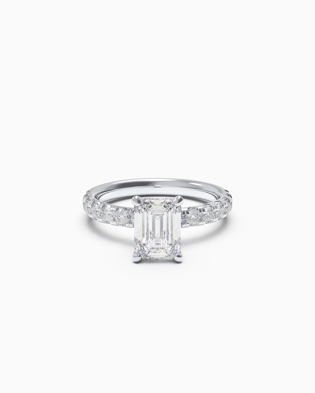 Emerald-cut diamond engagement ring with a French-set diamond band in white or yellow gold, front view on white background.