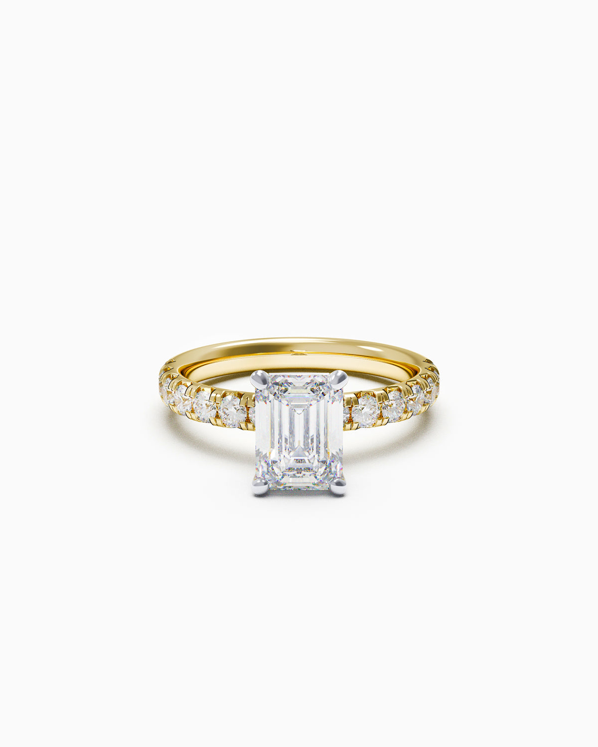 Emerald-cut diamond engagement ring with a French-set diamond band in white or yellow gold, front view on white background.