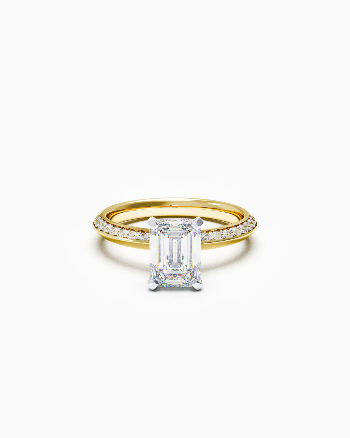 Emerald-cut diamond engagement ring with pavé knife-edge band in yellow or white gold, front view on white background.