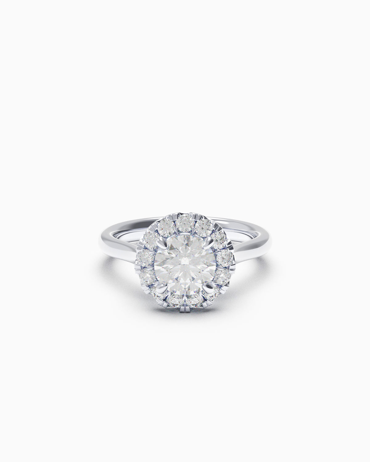 Round brilliant diamond halo engagement ring with pavé-set halo and plain band, shown in yellow and white gold, available in any 18k metal.