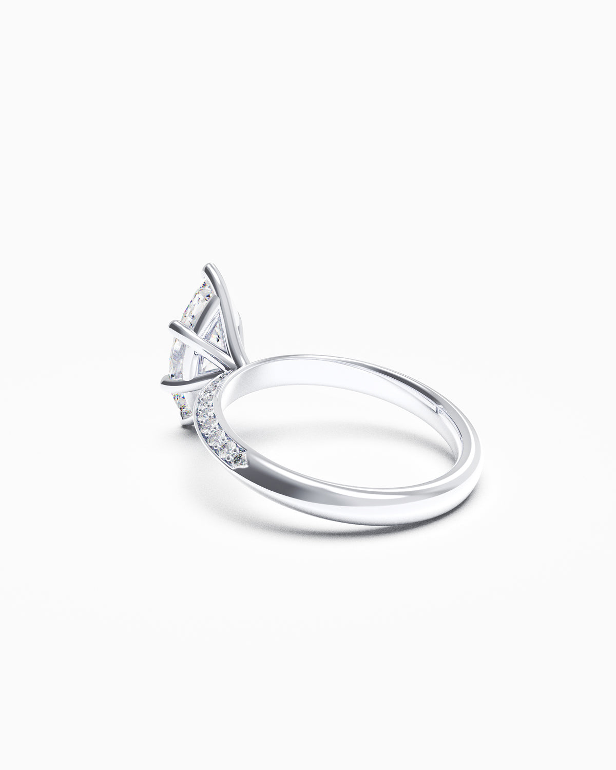 Side profile of a marquise diamond ring with pavé knife-edge band, highlighting the sharp taper and delicate elevation of the setting.