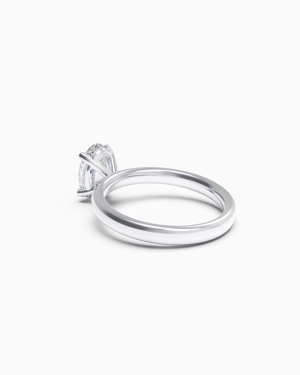 side view of an engagement ring featuring an oval-cut diamond in a double claw setting, available in yellow or white gold, photographed on a white background.