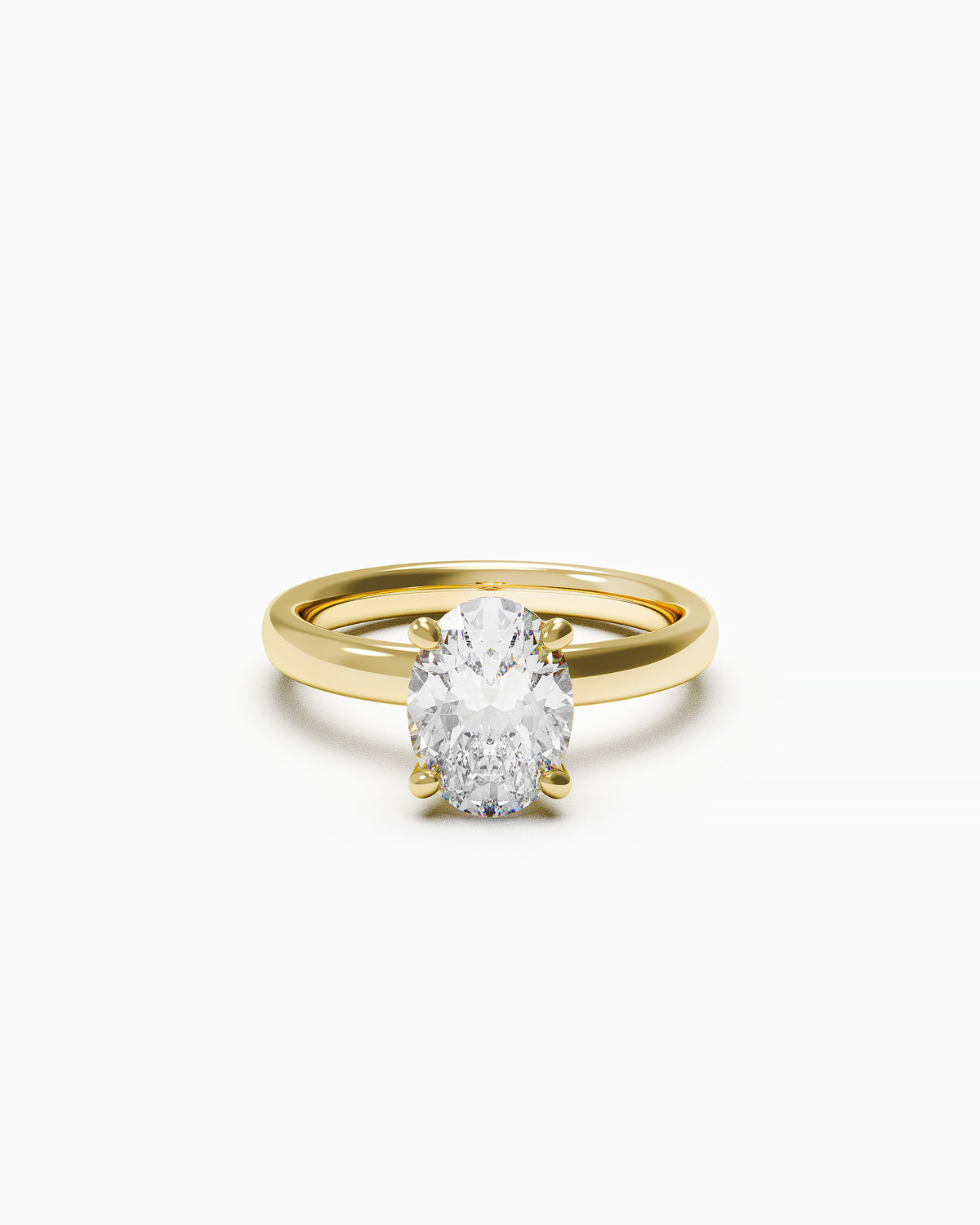an engagement ring featuring an oval-cut diamond in a double claw setting, available in yellow or white gold, photographed on a white background.