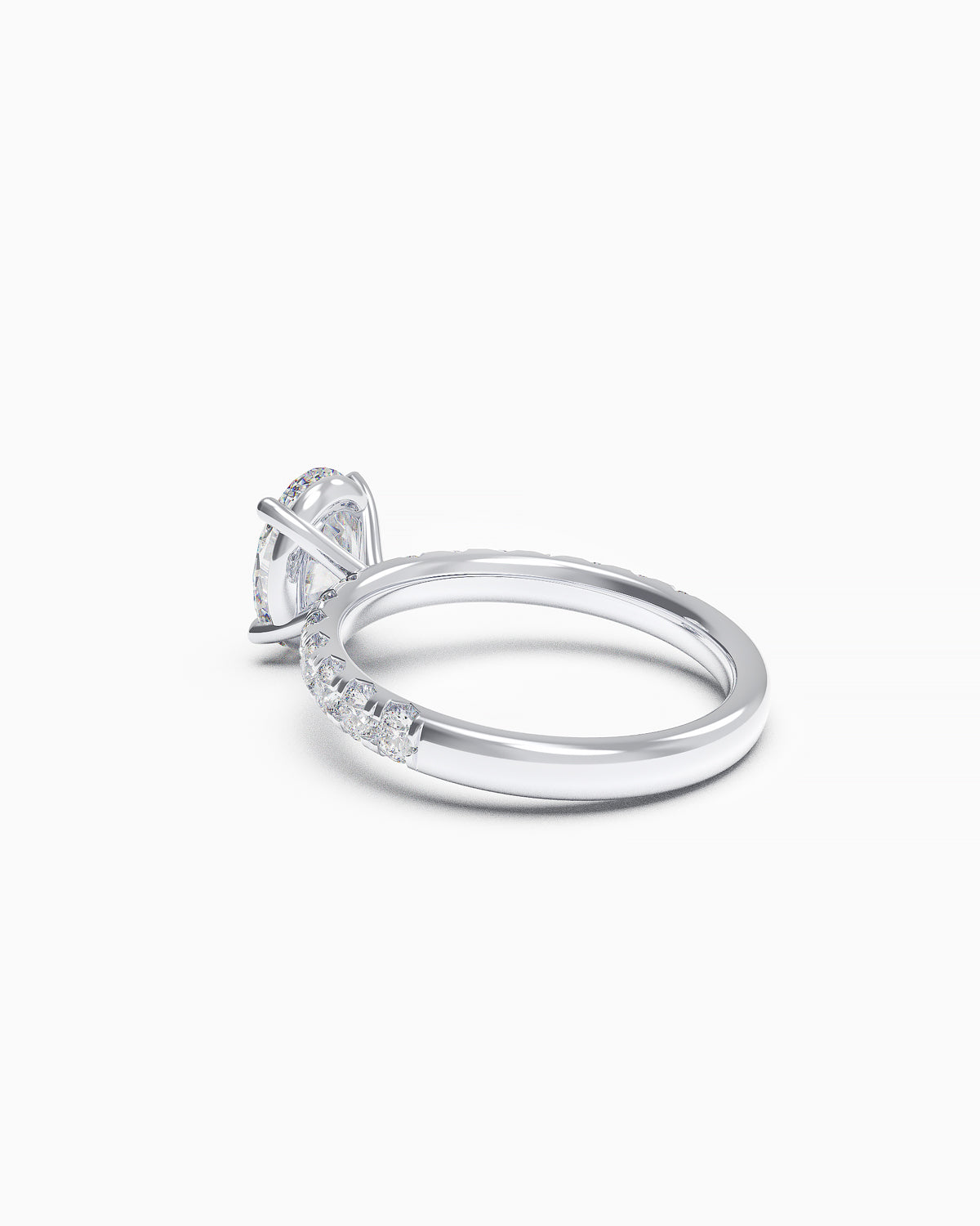 Side profile of an oval-cut diamond ring with a French-set band, showing the elevated setting and diamond detailing along the shoulders.