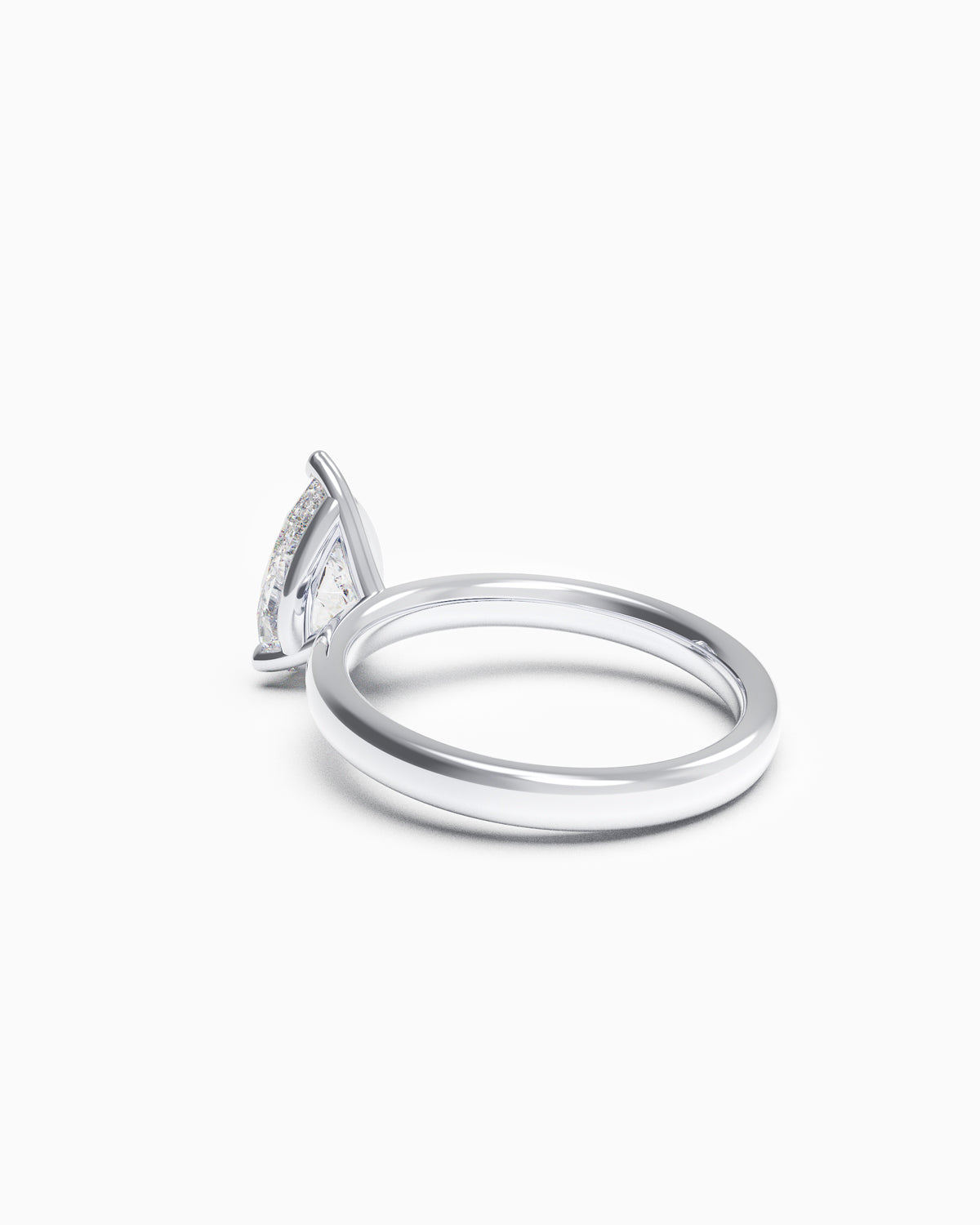 Side profile of a pear-shaped diamond ring with three-prong setting, showing the soft taper of the band.