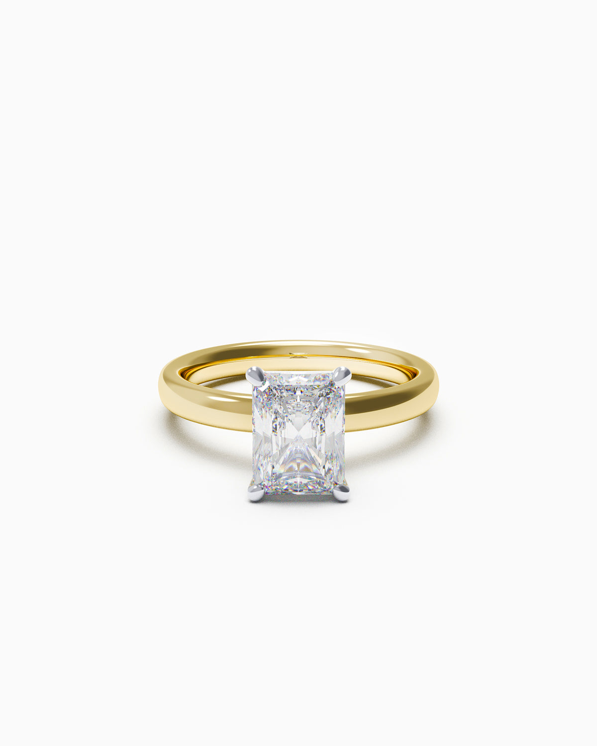 A radiant-cut diamond solitaire engagement ring in a four-claw setting, available in yellow or white gold, photographed on a white background.