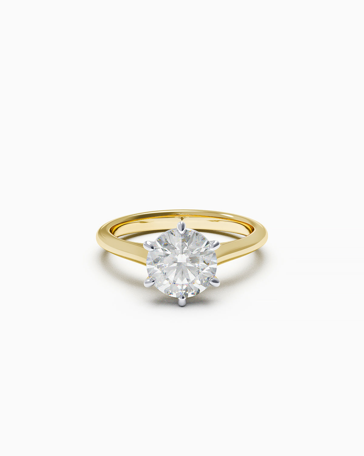 Round brilliant-cut diamond solitaire ring with six claws and cathedral shoulders, available in white or yellow gold, front view on a white background.