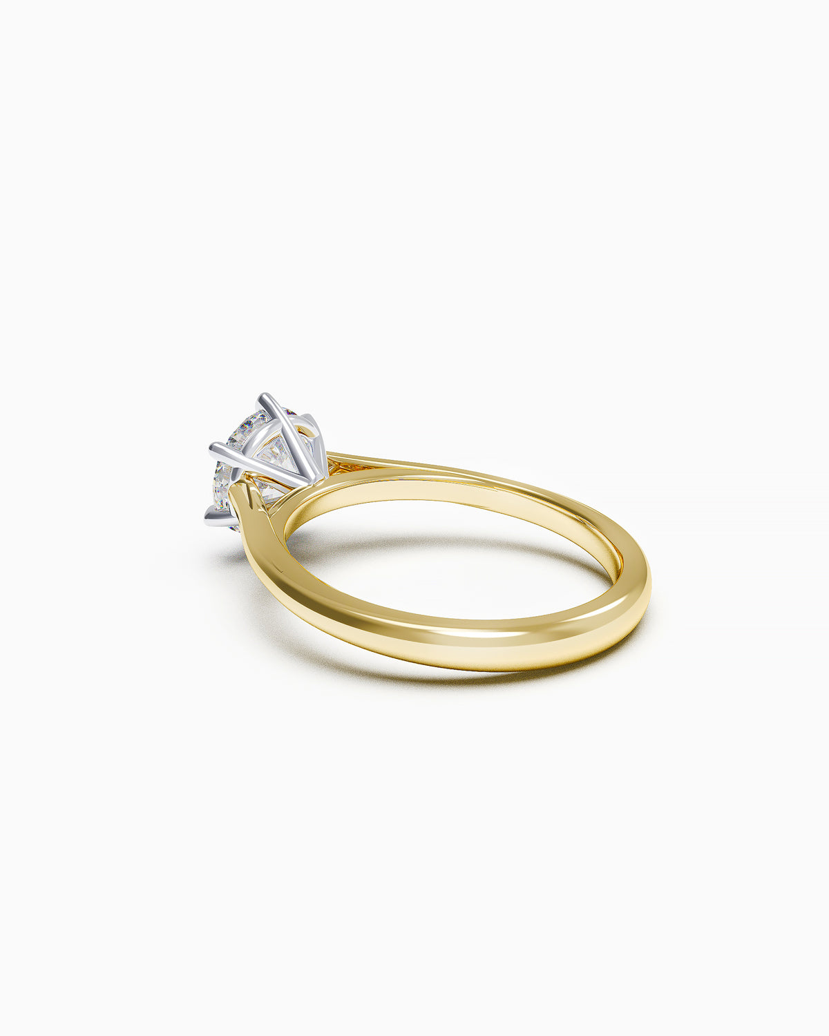 Side profile of a round brilliant solitaire ring with elevated cathedral setting in white or yellow gold, showing the sculptural shoulders and prong details.