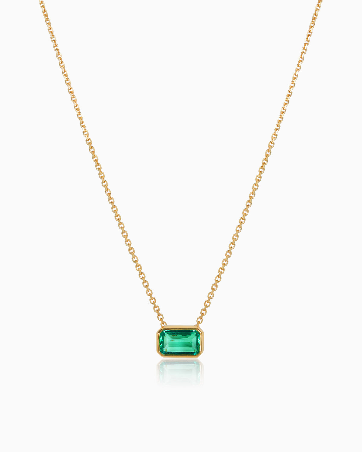 colombian emerald bezel set pendant crafted in 18kyg