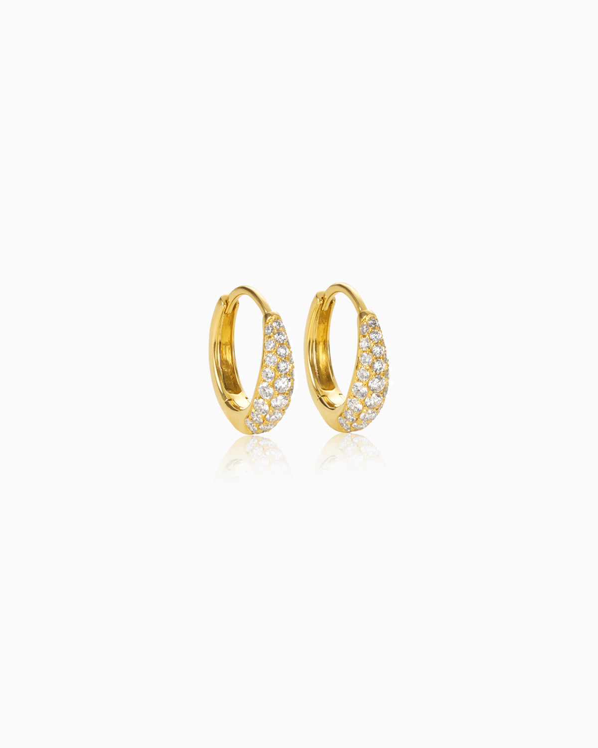 A pair of elegant hoop earrings made of 18k gold, encrusted with a pavé setting of small, brilliant diamonds totaling 0.68 carats. The earrings have a smooth, curved design and emit a radiant sparkle, perfect for adding a touch of sophistication to any outfit.