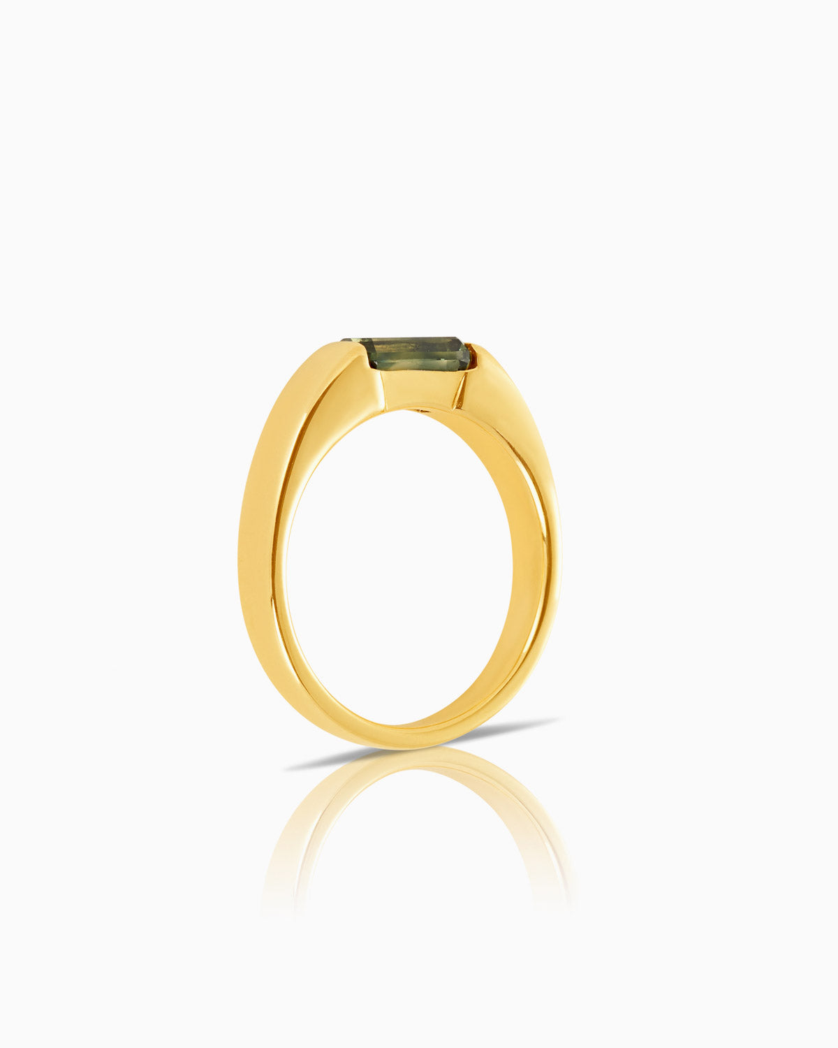 close up side view image of tension set australian sapphire ring featuring 18 karat yellow gold.