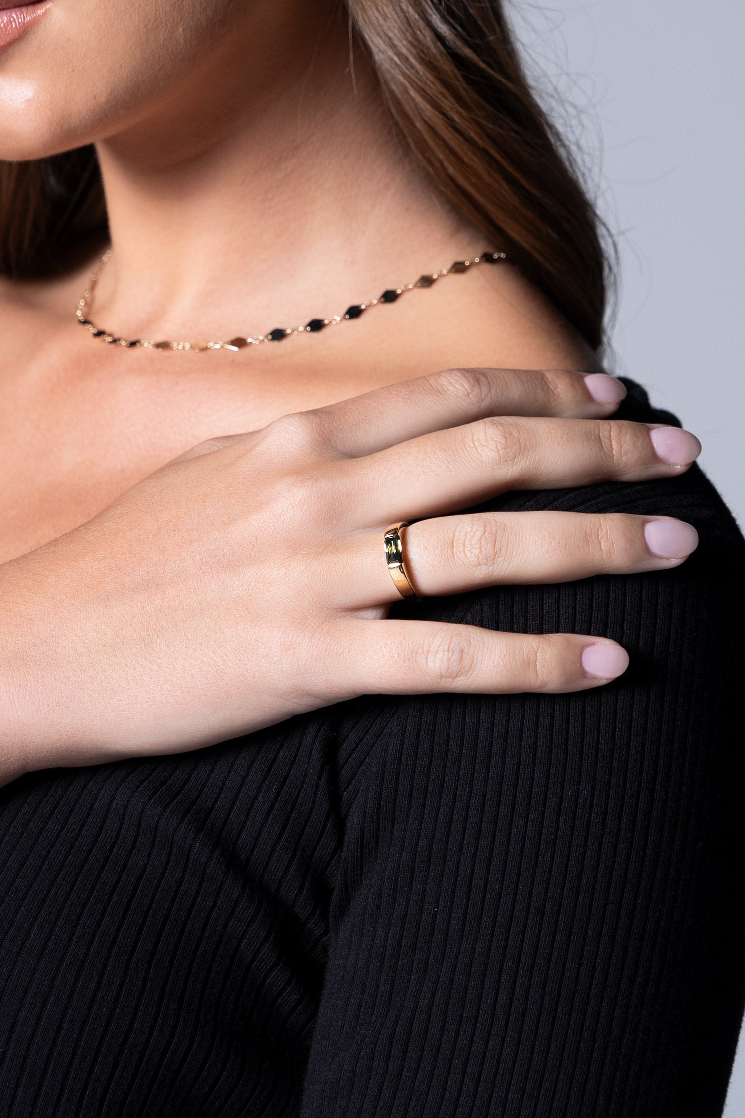 close up image of tension set australian sapphire ring worn by model Ellie Brinkman