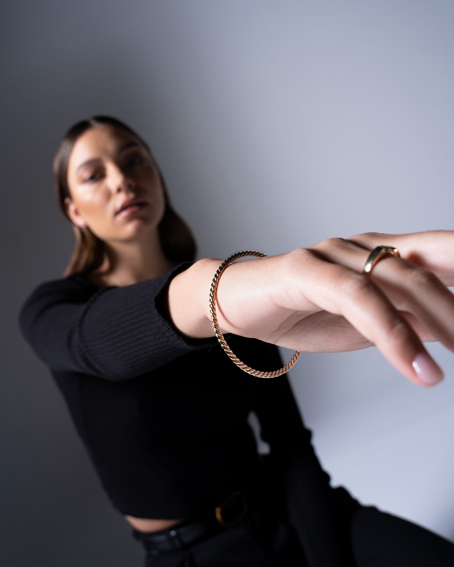 creative twisted solid gold bangle on model image