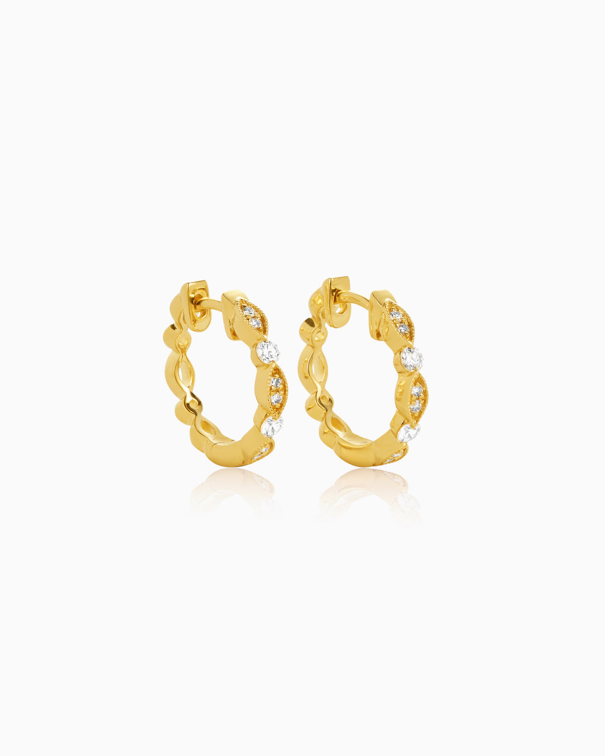 vintage diamond huggies crafted from 18k yellow gold side view by claude and me jewellery