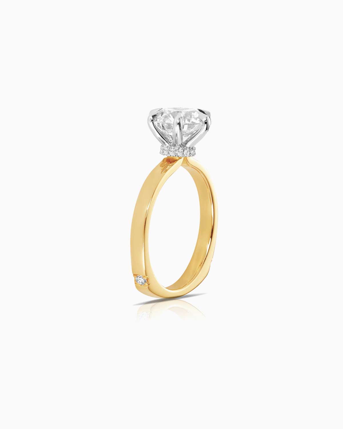 side view of 6 claw diamond solitaire engagement ring in 18 karat yellow gold by claude and me jewellery