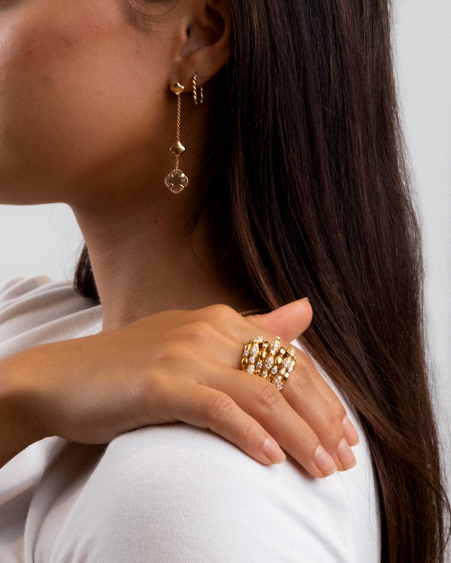 bamboo cascade diamond ring and flower amethyst drop earrings worn by brunette model.