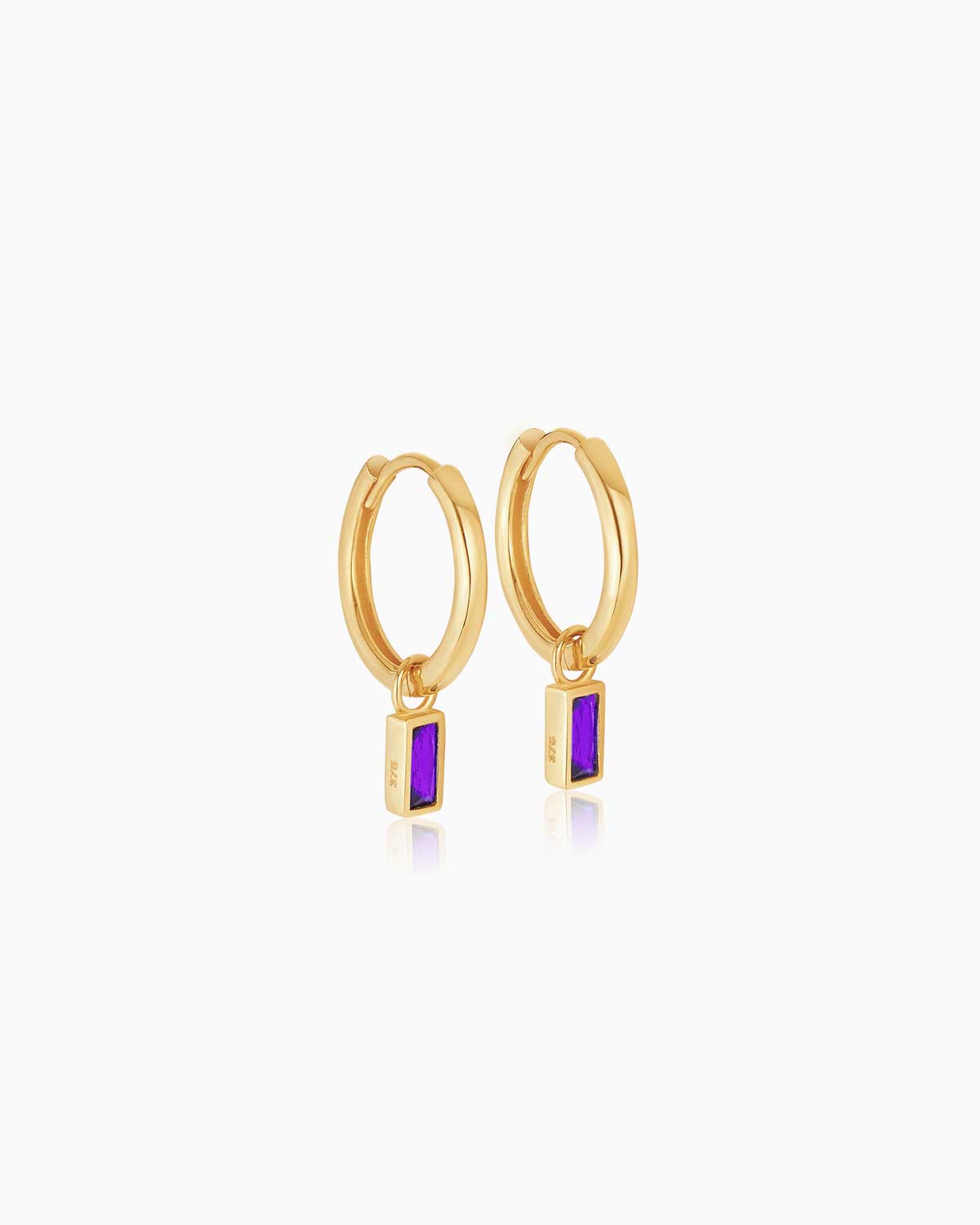 9 karat yellow gold charm hoop earrings with amethyst bezel set drops from the claude by Claudia collection.