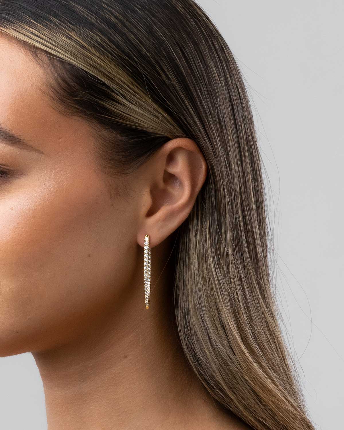 imperiale diamond hoops by claude and me jewellery on a models ear