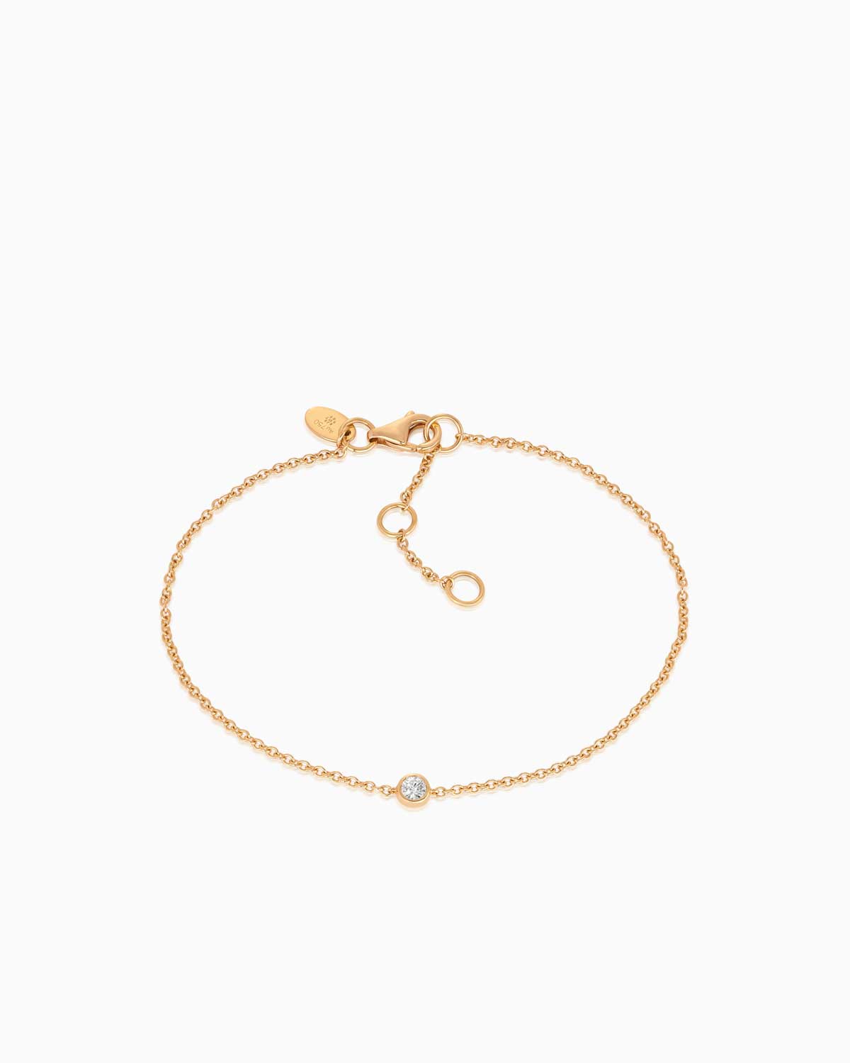 Petit single stone diamond bracelet featuring 18 karat yellow gold by claude and me jewellery.
