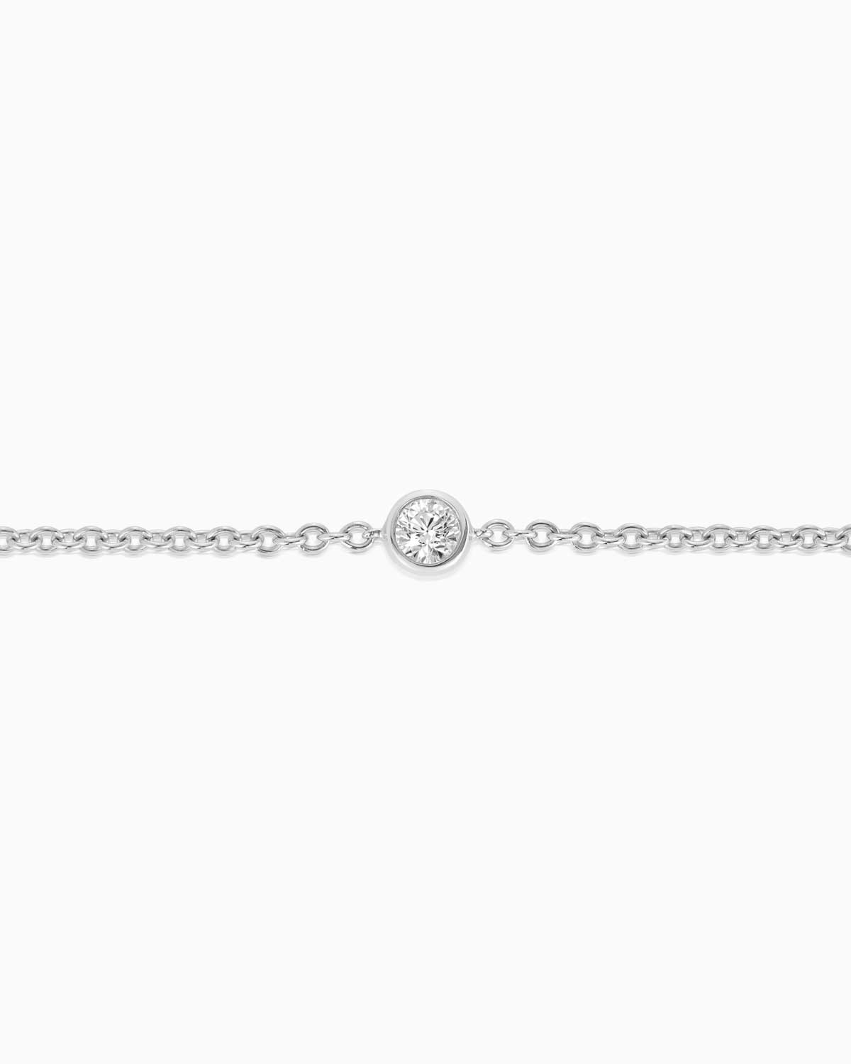 Close up view of Petit single stone diamond bracelet featuring 18 karat white gold by claude and me jewellery.