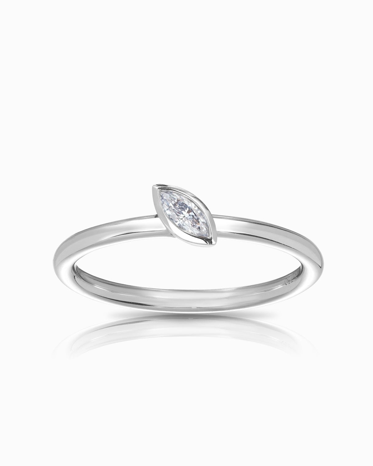18k white gold ring with a 0.10ct marquise-cut diamond set in a sleek full bezel setting, designed as a fine stacker band.