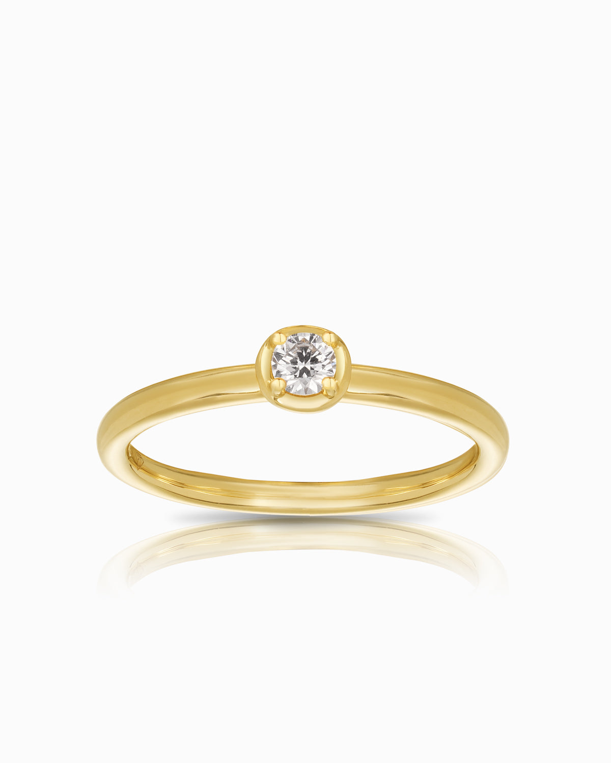 18k yellow gold ring featuring a 0.12ct round brilliant diamond in a hybrid bezel-prong setting, designed as a delicate stacker band.