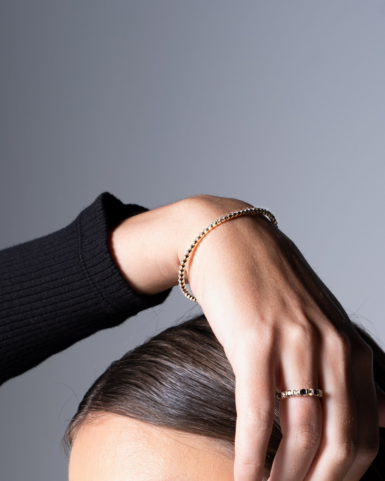 close up image of diamond accent flexi bangle worn by model Ellie Brinkman