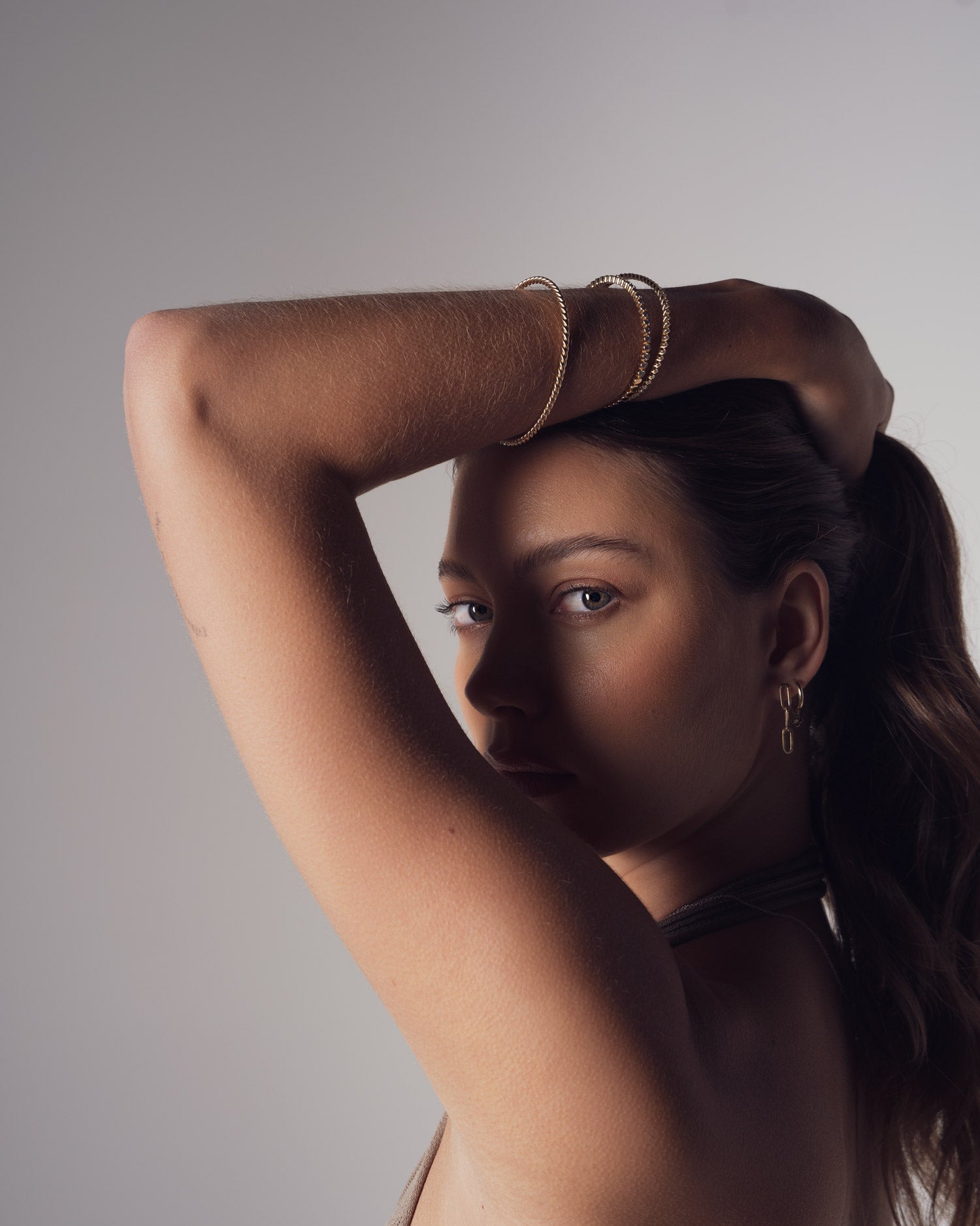 ellie brinkman wearing claude and me jewellery diamond and gold bangles for the latest collection photoshoot
