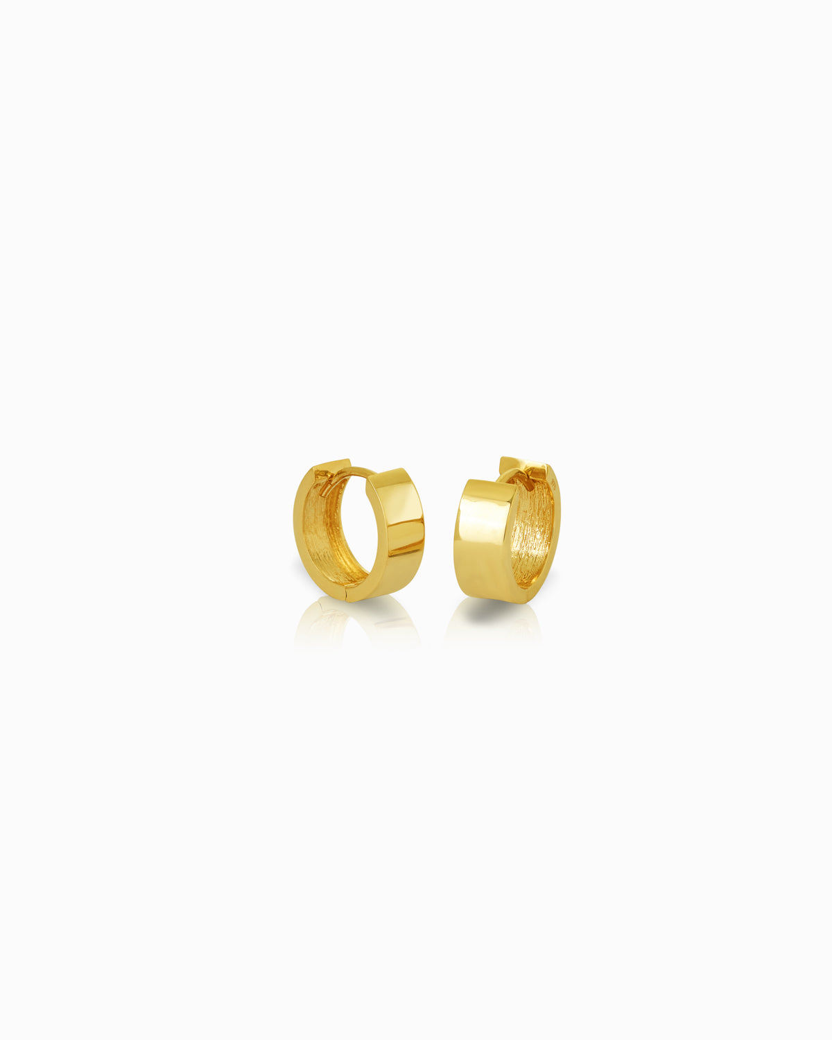 Flat 10x5mm 9k yellow gold huggie earrings with a polished finish, from the Claude by Claudia collection.