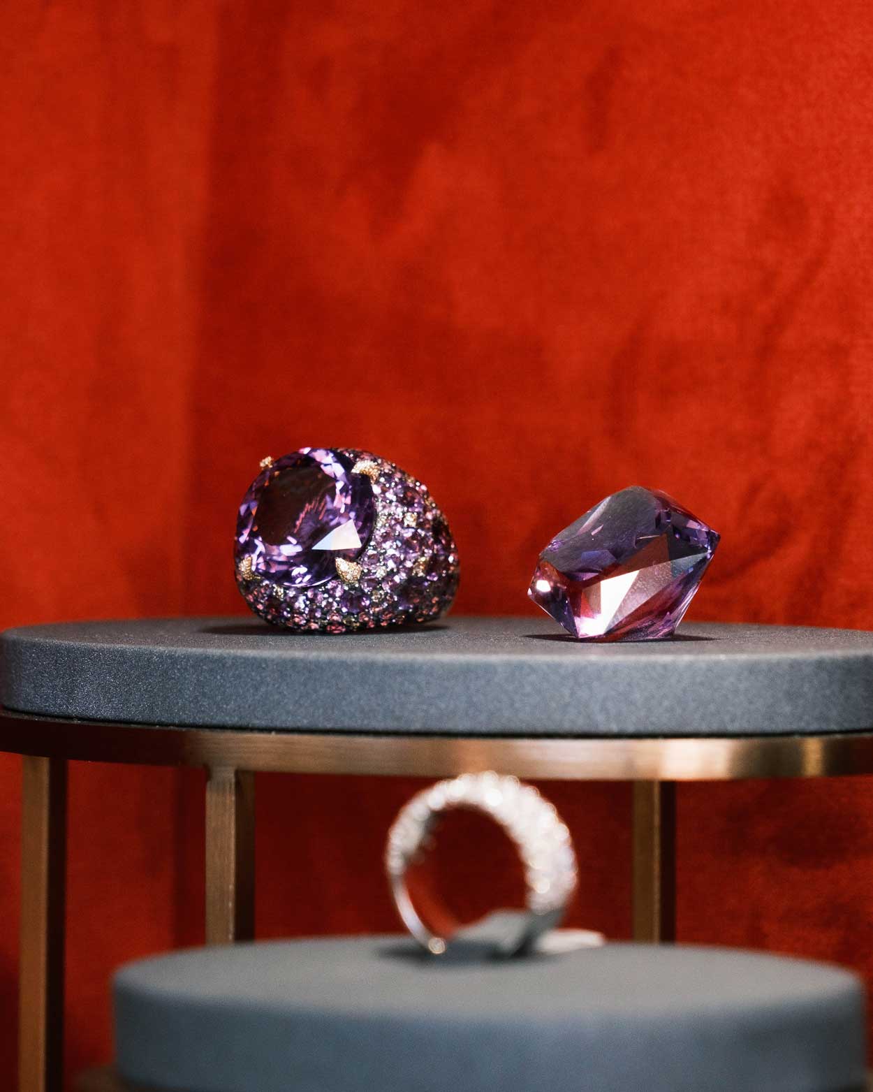 amethyst and diamond wedding band resting on jewellery showcase in the claude and me jewellery Milton store