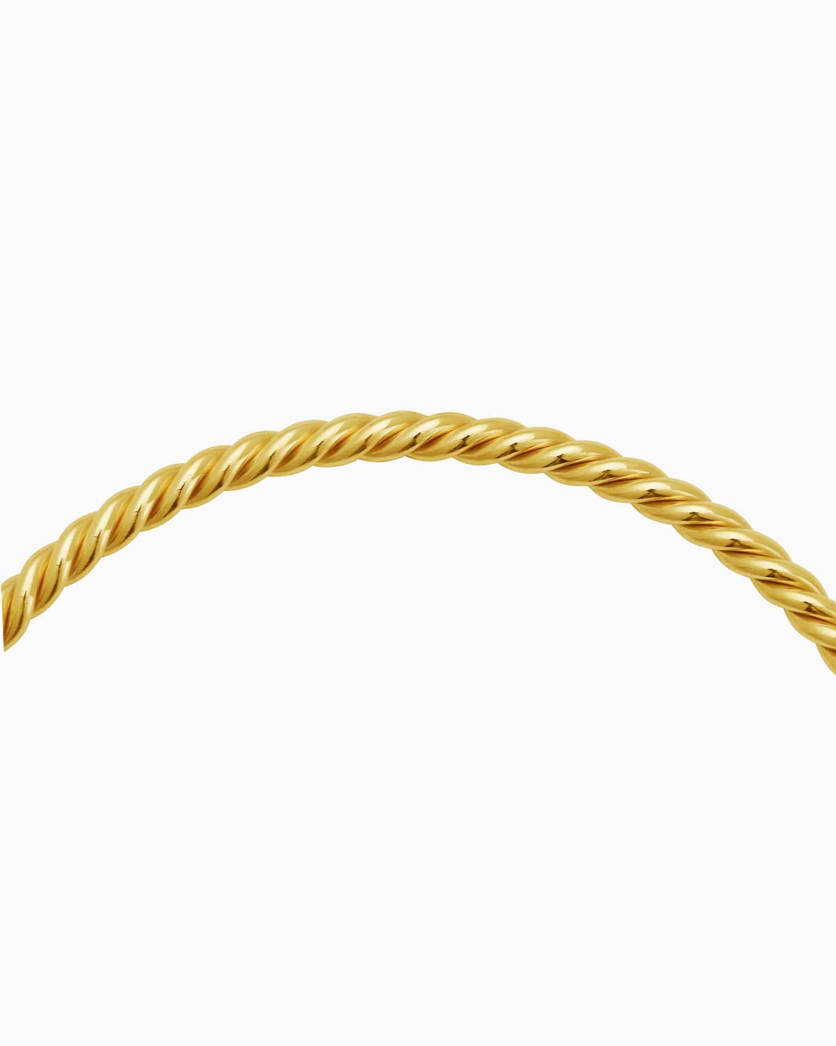 close up of 9 karat yellow gold solid twisted bangle
