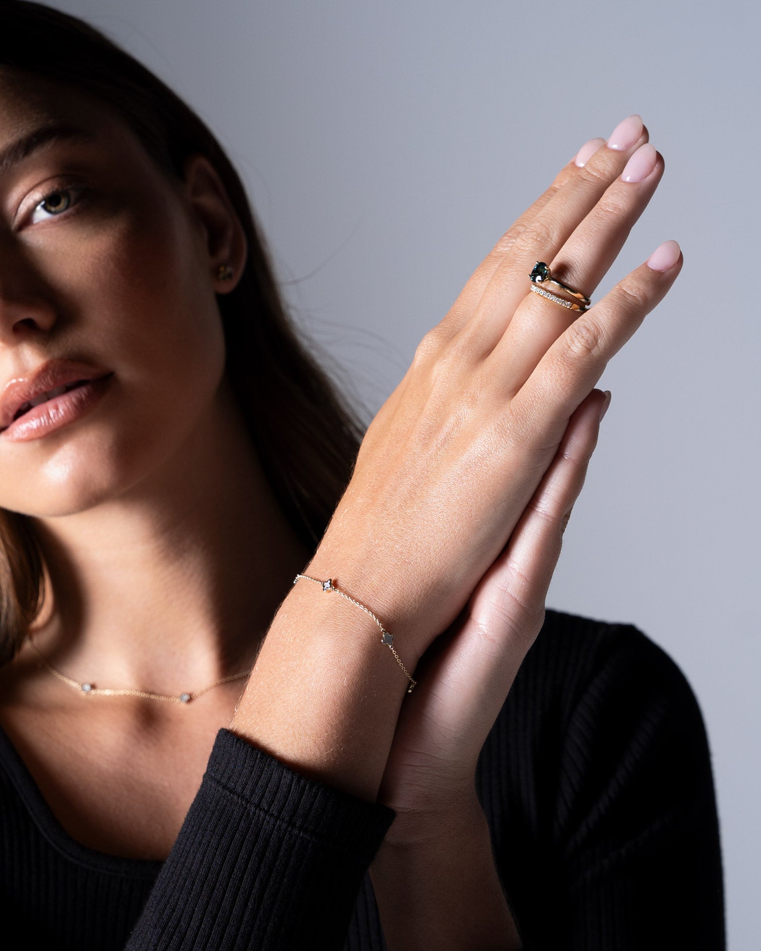 fine clover bracelet and sapphire engagement ring collection worn by Ellie Brinkman