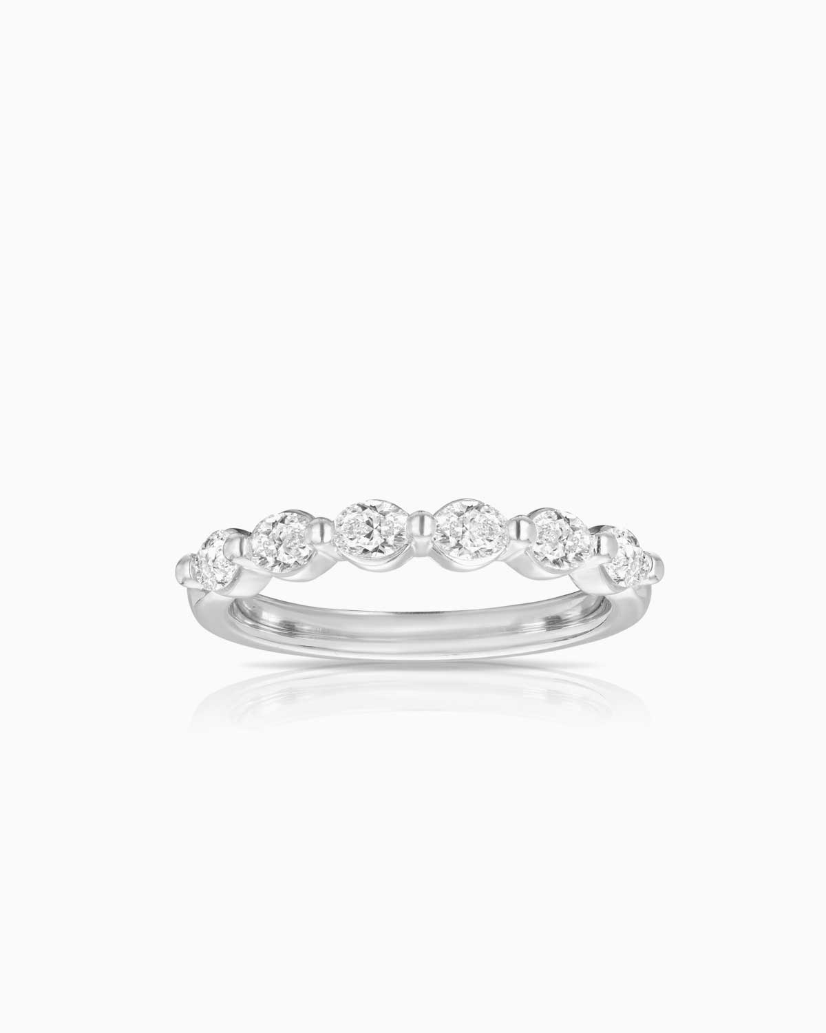 18 karat white gold petit prong oval diamond band 6 stone