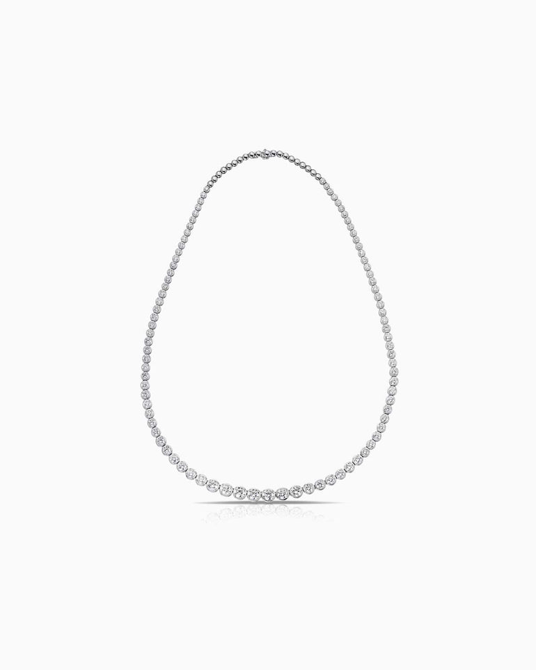 10.00 total diamond weight necklace, featuring graduated bezel set diamonds and 18 karat white gold.