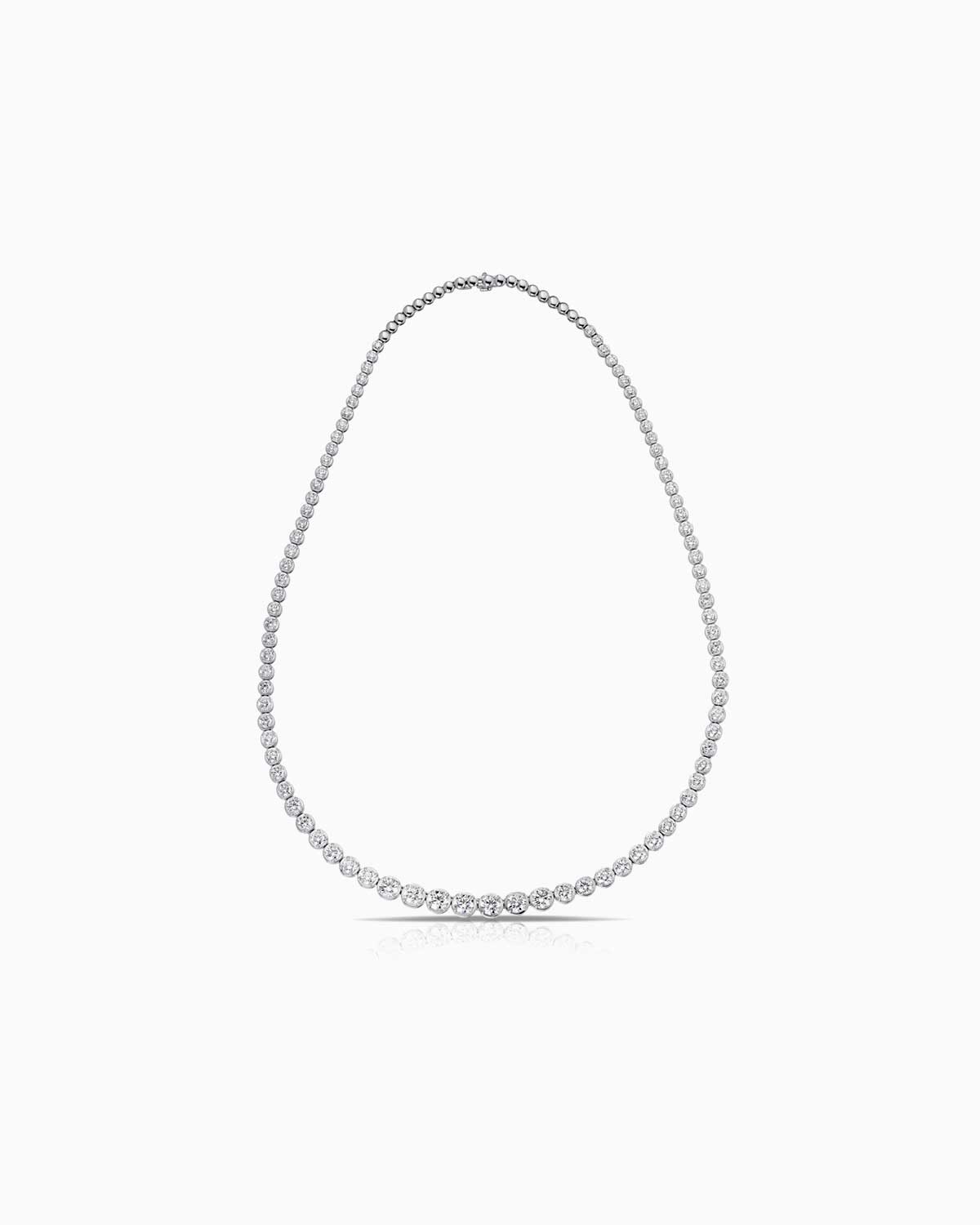 10.00 total diamond weight necklace, featuring graduated bezel set diamonds and 18 karat white gold.
