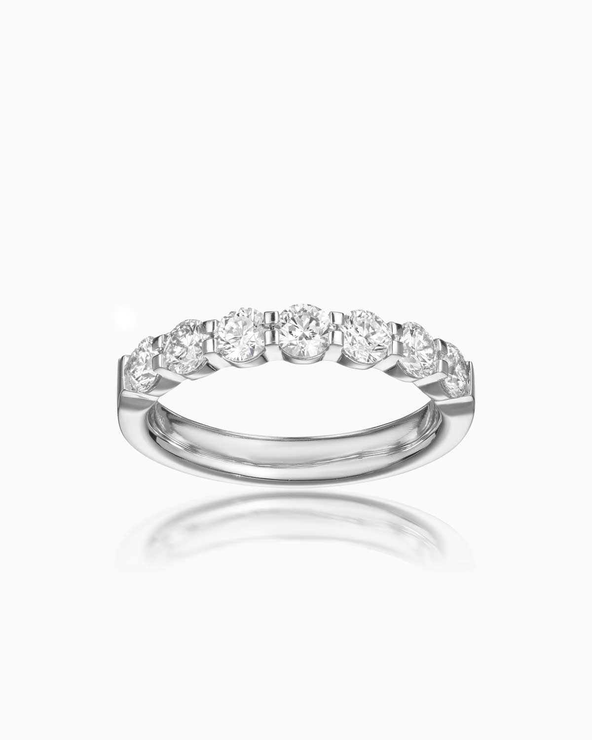 7 stone quintessential diamond wedding band in 18 karat white gold by claude and me jewellery.