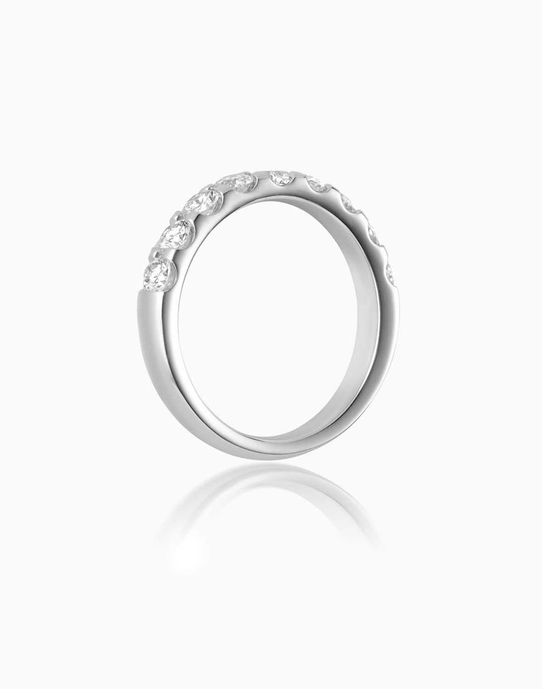 Quintessential 9 stone diamond band featuring platinum alloy by claude and me jewellery.