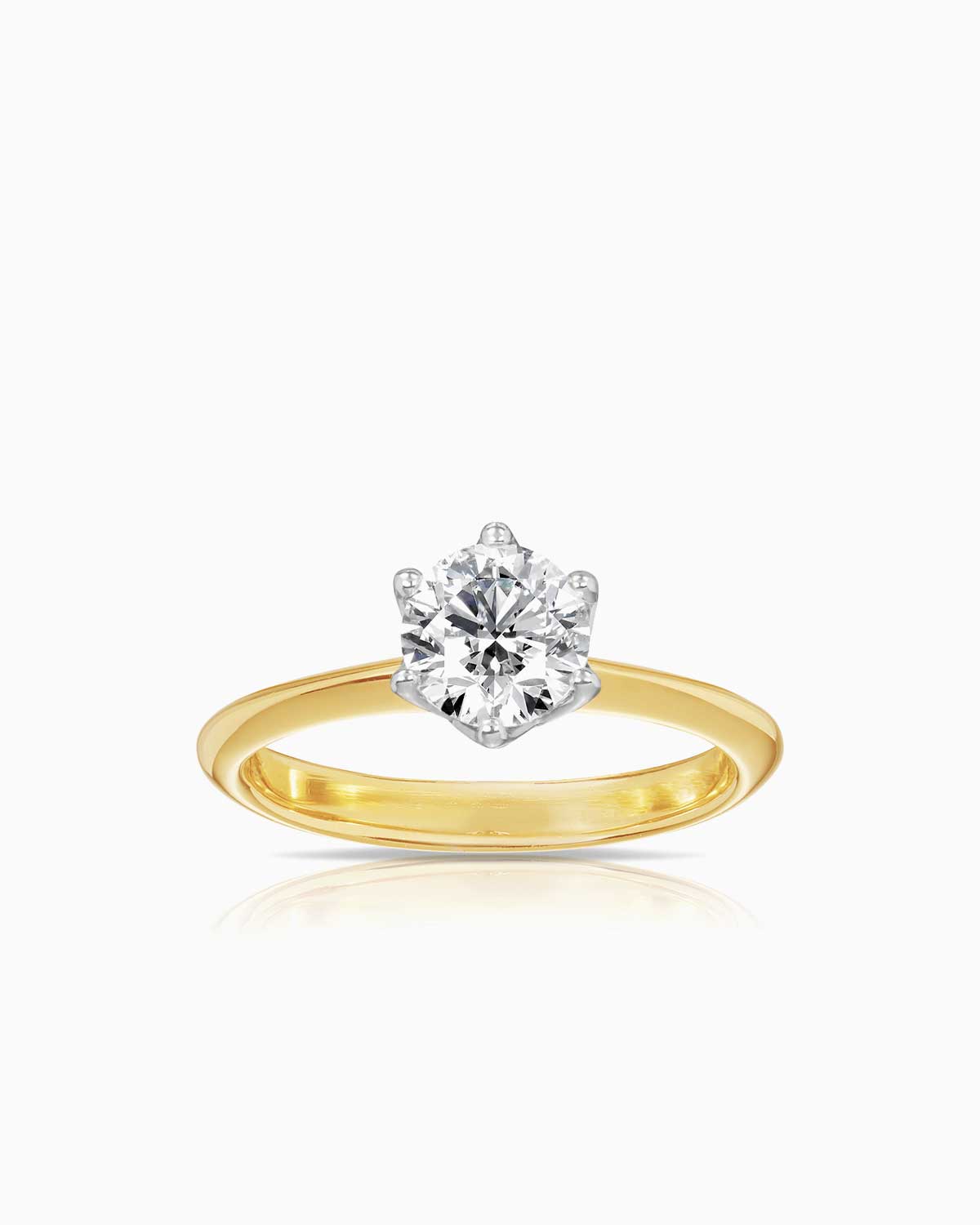 Round 6 claw basket solitaire engagement ring featuring 18 karat yellow and white gold by claude and me jewellery.