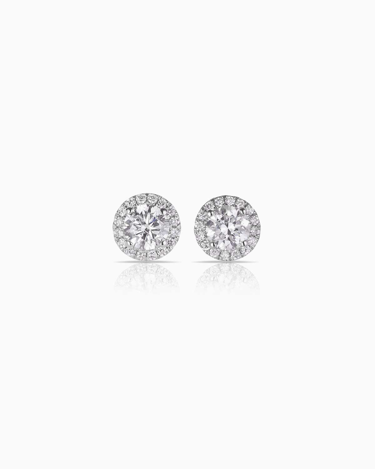 Halo diamond earrings set in 18 karat white gold