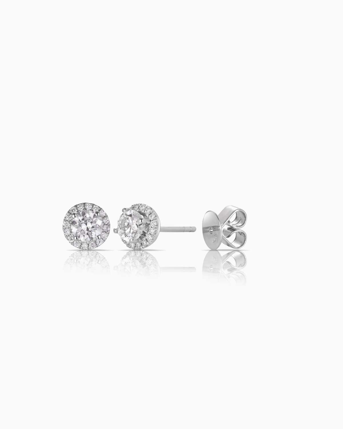 18 karat white gold diamond halo earrings featuring butterfly secure backs