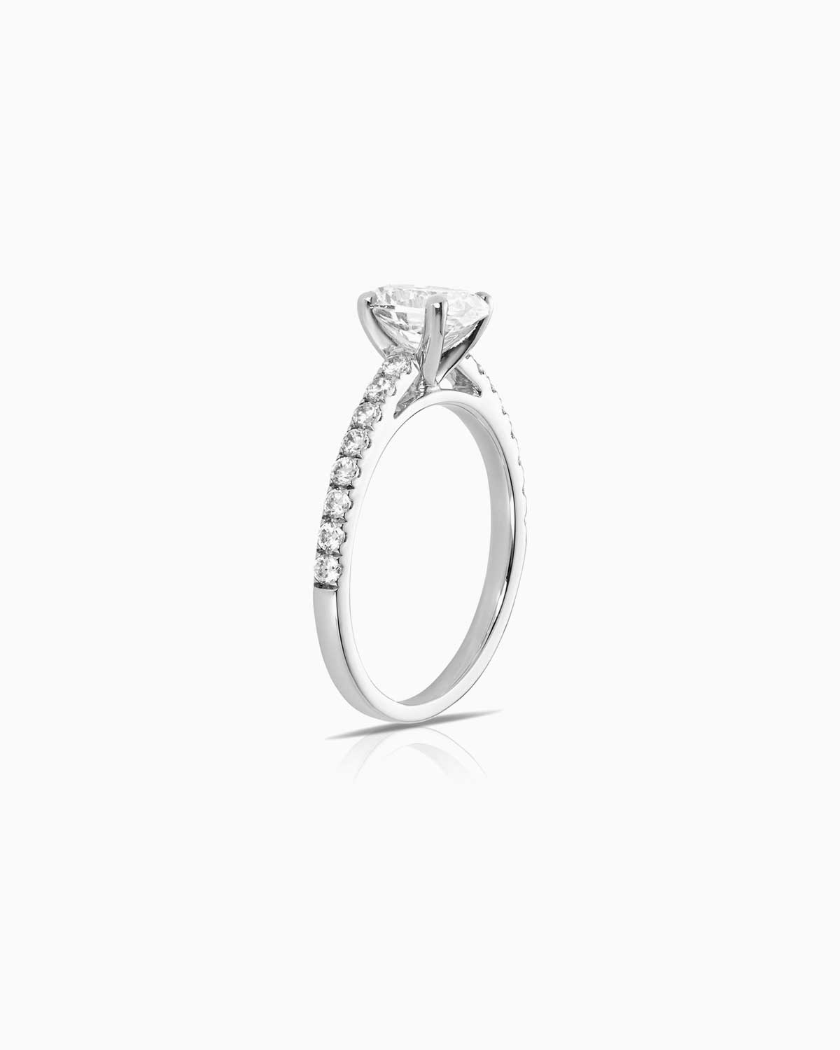 oval diamond engagement ring featuring shoulder diamonds and set in 18 karat white gold by claude and me jewellery