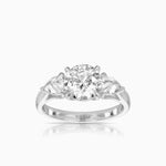 pear and round diamond trilogy engagement ring in 18k white gold by claude and me jewellery
