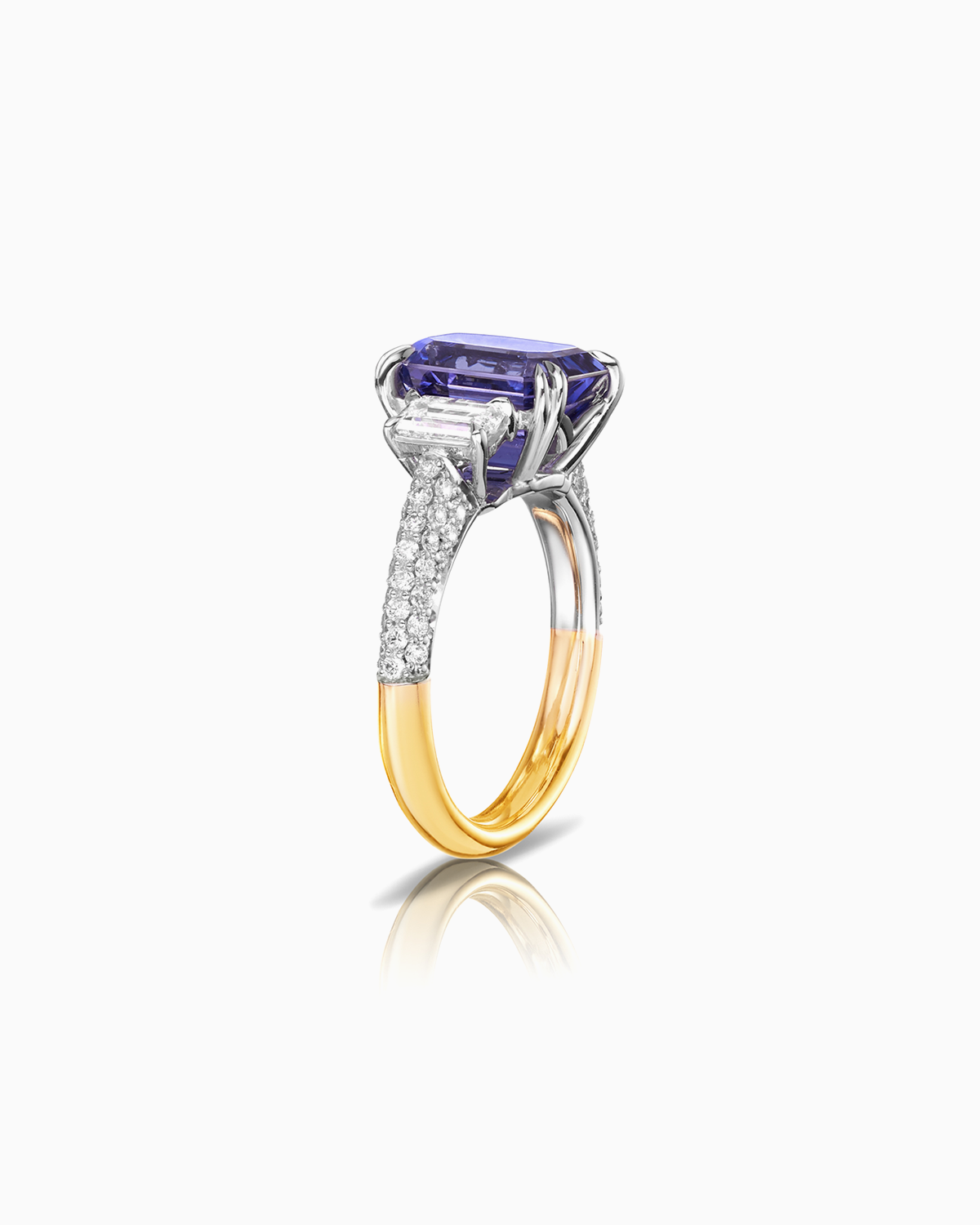 Side view of 3.78ct tanzanite and diamond trilogy with pave set diamond shoulders and 18 karat white and yellow gold by claude and me jewellery.