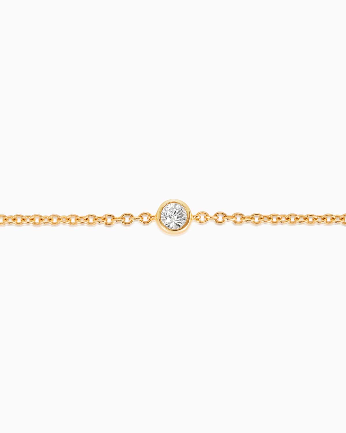 Close up view of Petit single stone diamond bracelet featuring 18 karat yellow gold by claude and me jewellery.